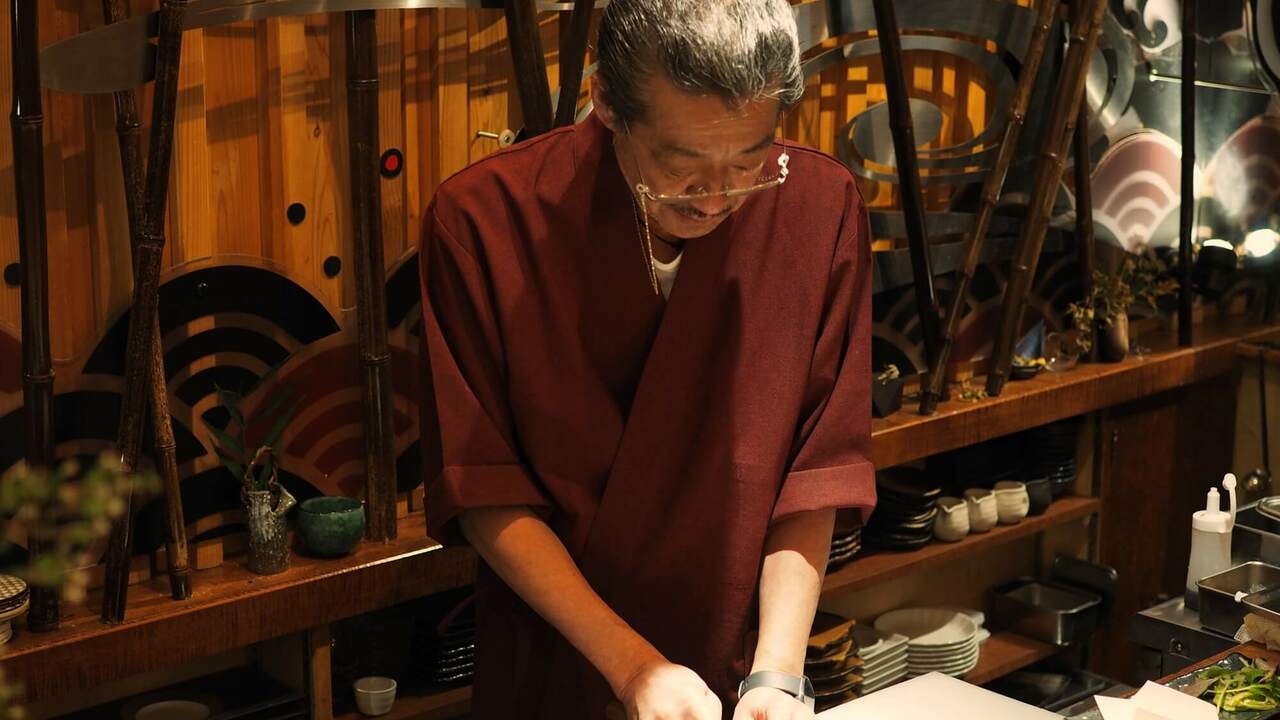 魚心で働く人の写真1枚目