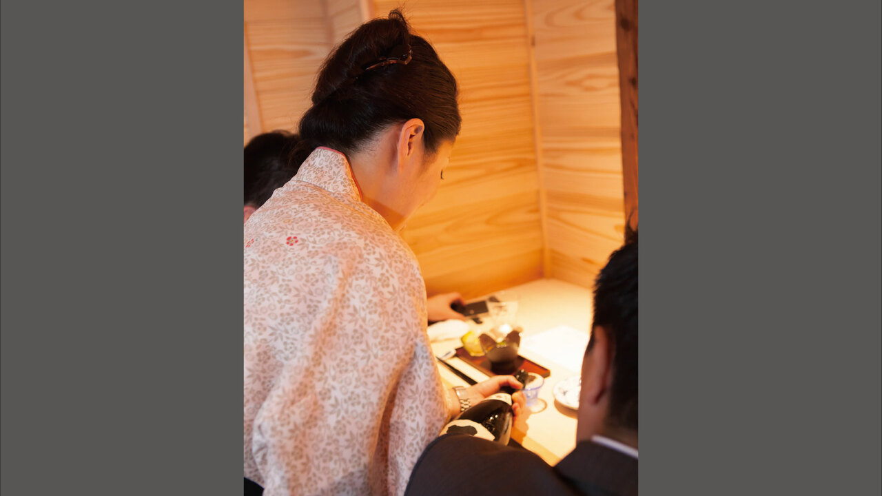 魚釜で働く人の写真2枚目