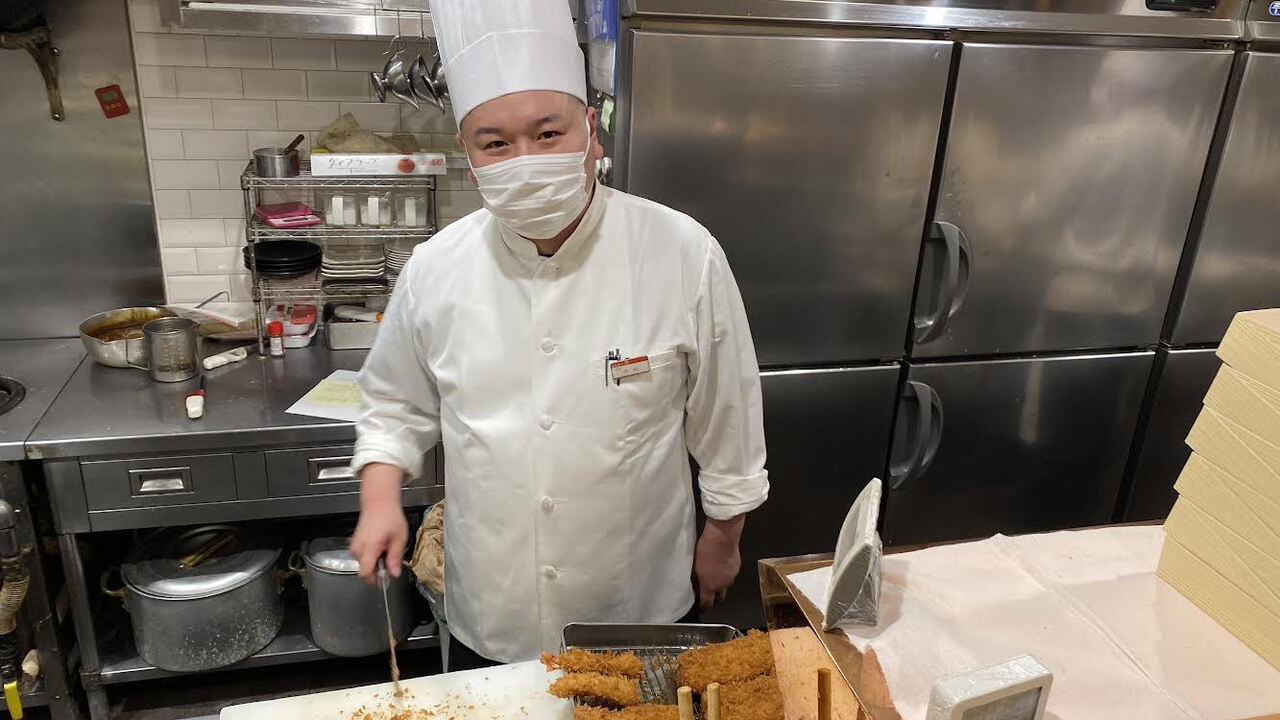 豚料理　田で働く人の写真1枚目